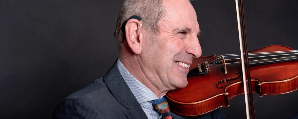 cochlear implant and music: the musician and CI user Walter with his violin